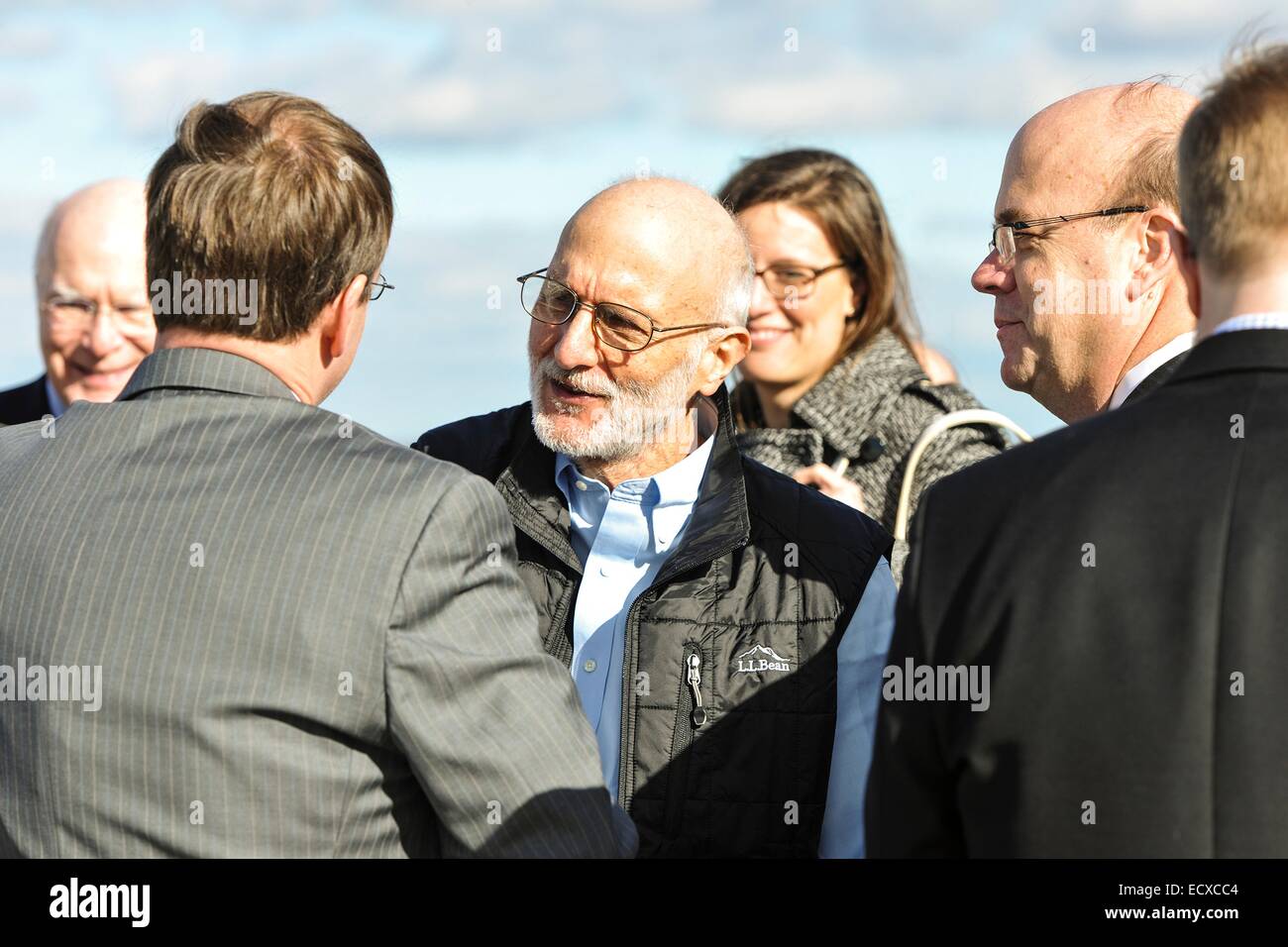 USAID contractor Alan Gross, imprisoned in Cuba for five years, is greeted by Senators and family members after a flight back from Cuba following his release December 17, 2014 at Andrews Air Force Base in Maryland. Stock Photo