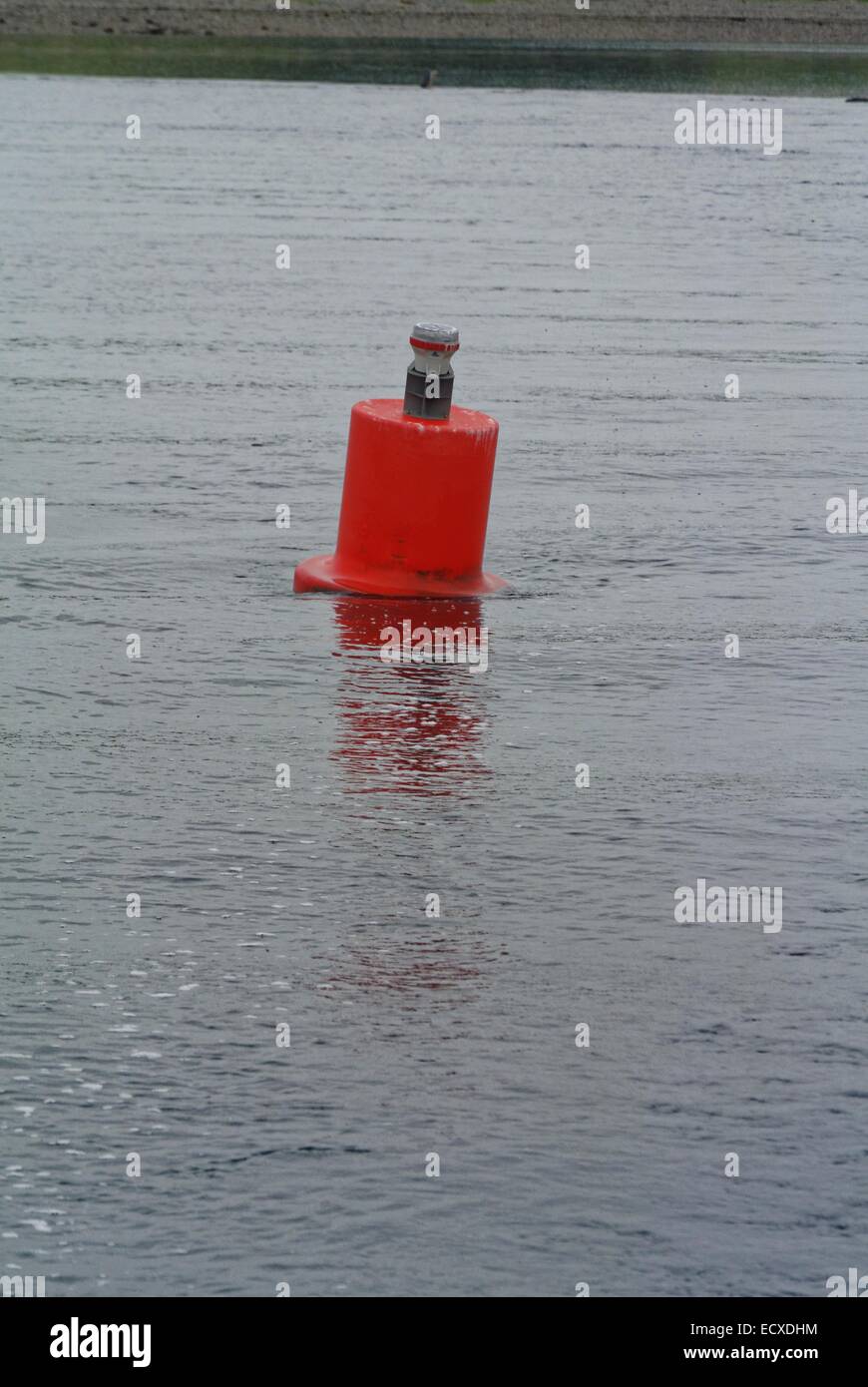 Channel marker buoy showing tidal flow in calm sea Stock Photo Alamy