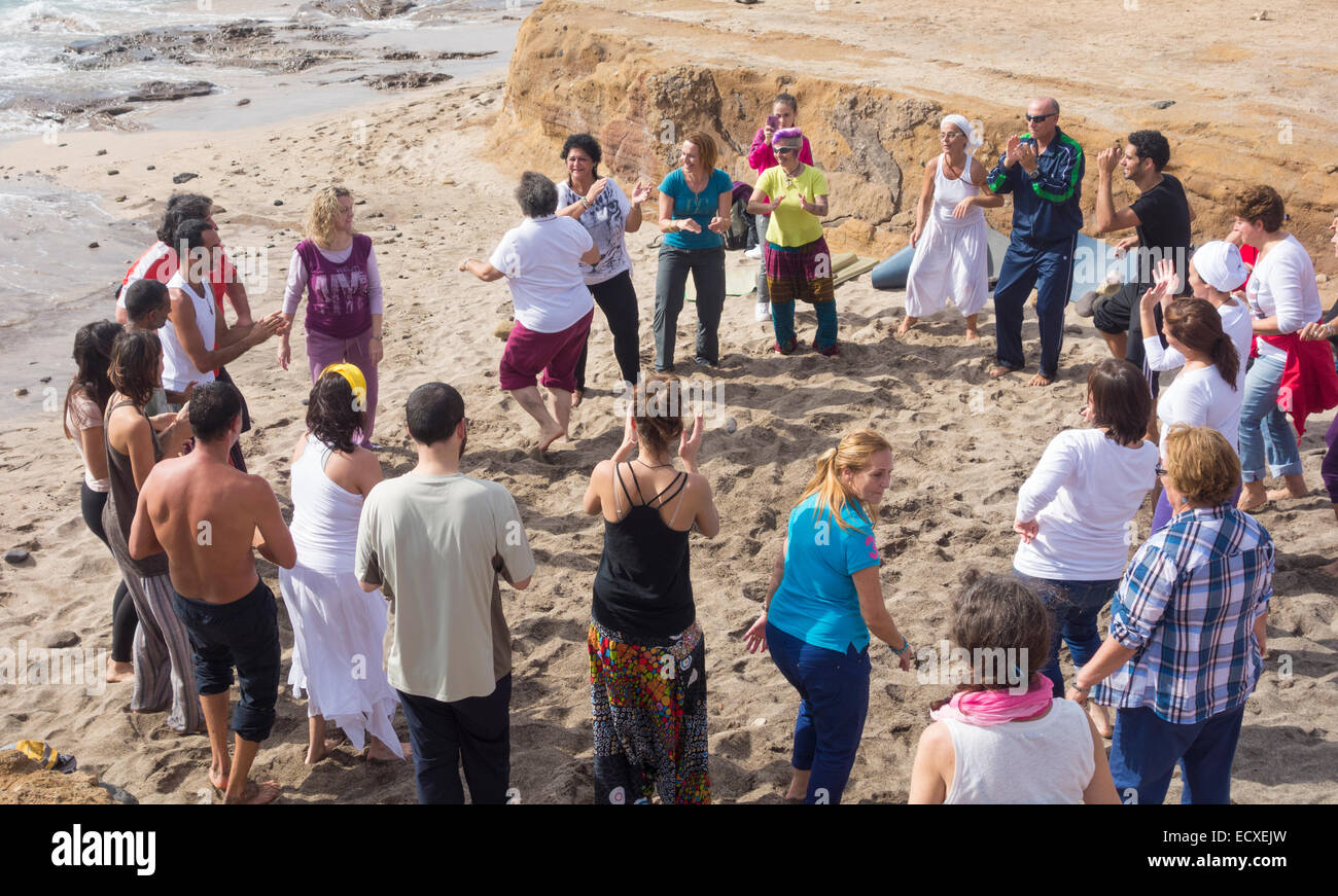 Winter Solstice celebrations on beach in Spain Stock Photo Alamy