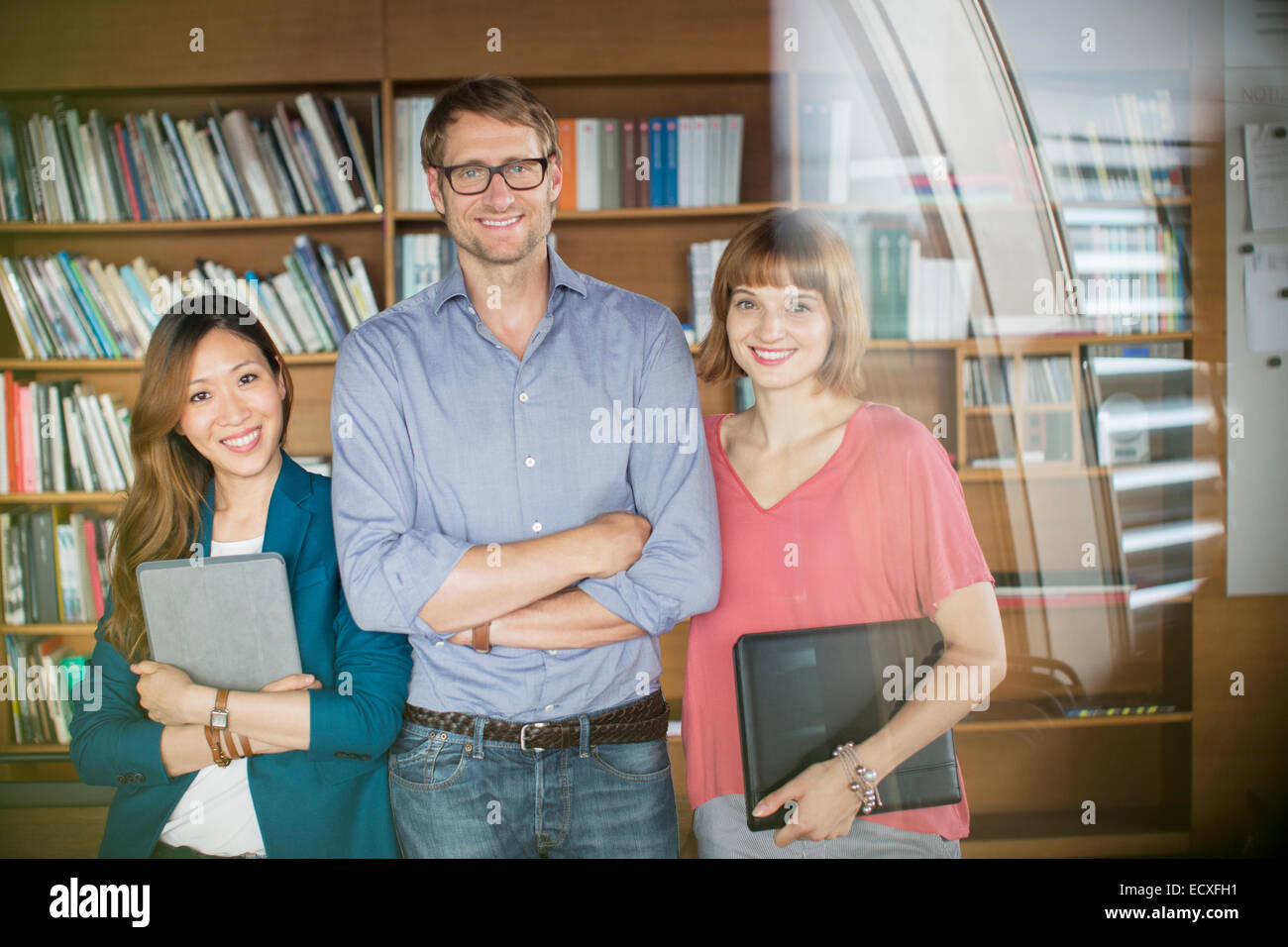 Business people smiling in office Stock Photo - Alamy