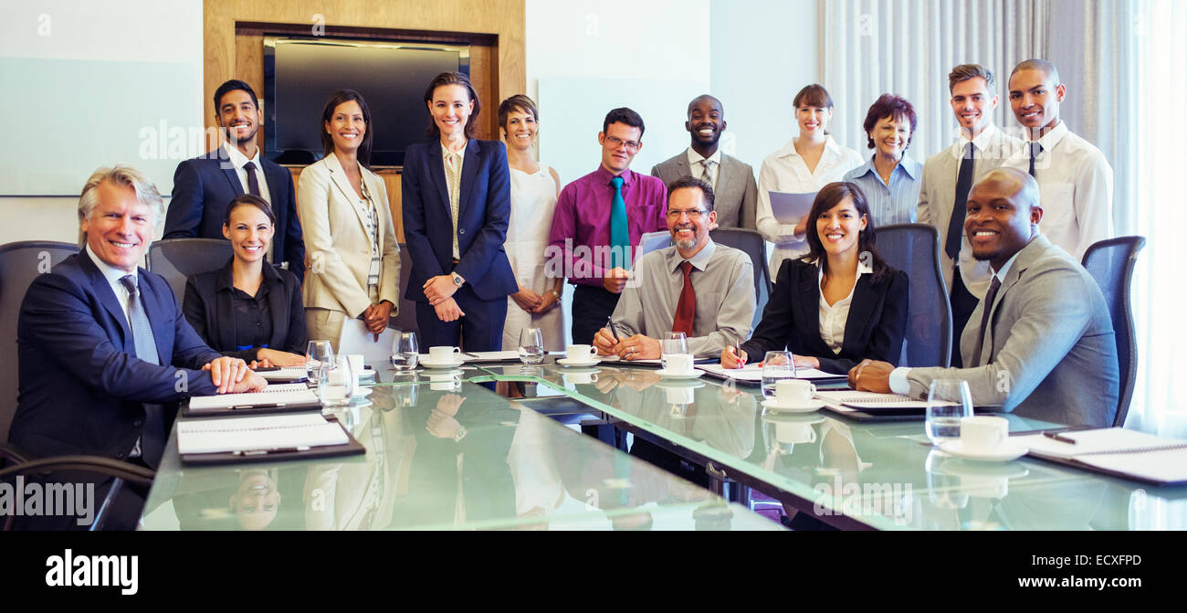 Group portrait of smiling business people in conference room Stock Photo