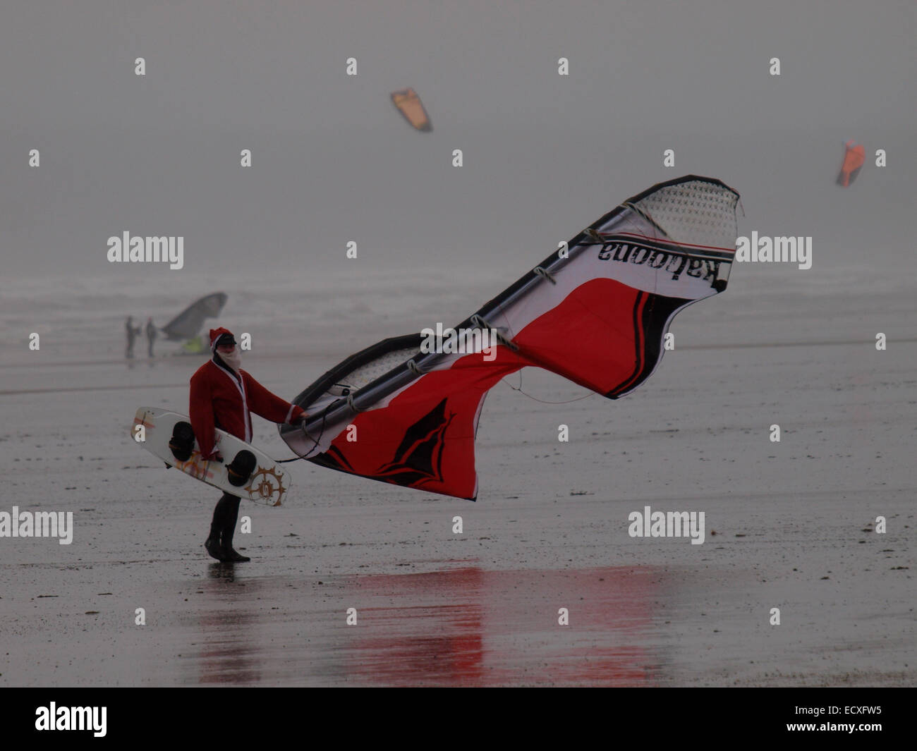 Kite surfer dressed as Santa, Westward Ho!, Devon, UK Stock Photo