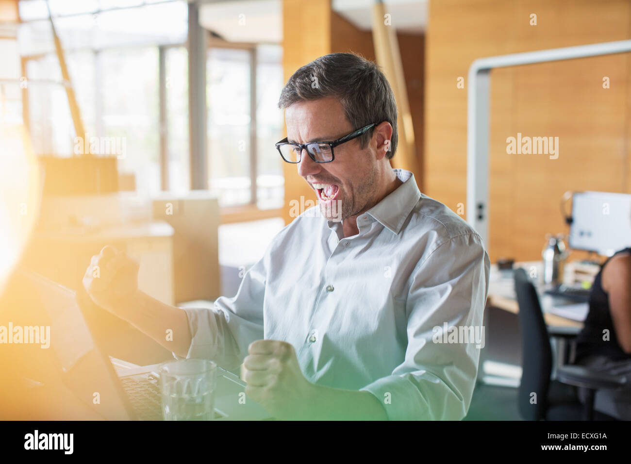 Person cheering with laptop hi-res stock photography and images - Alamy