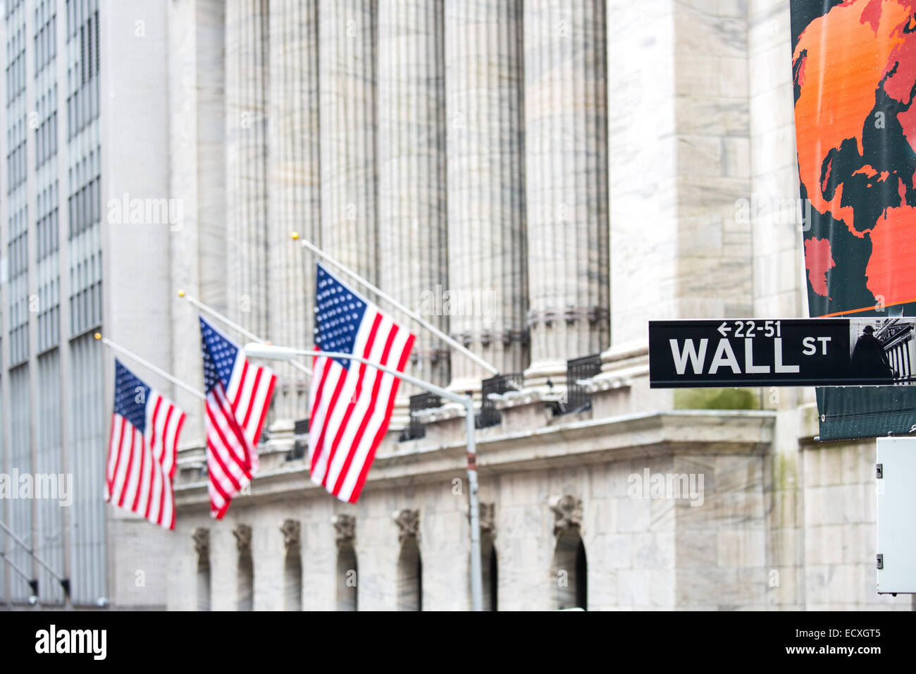 Wall street sign in New York with New York Stock Exchange background ...