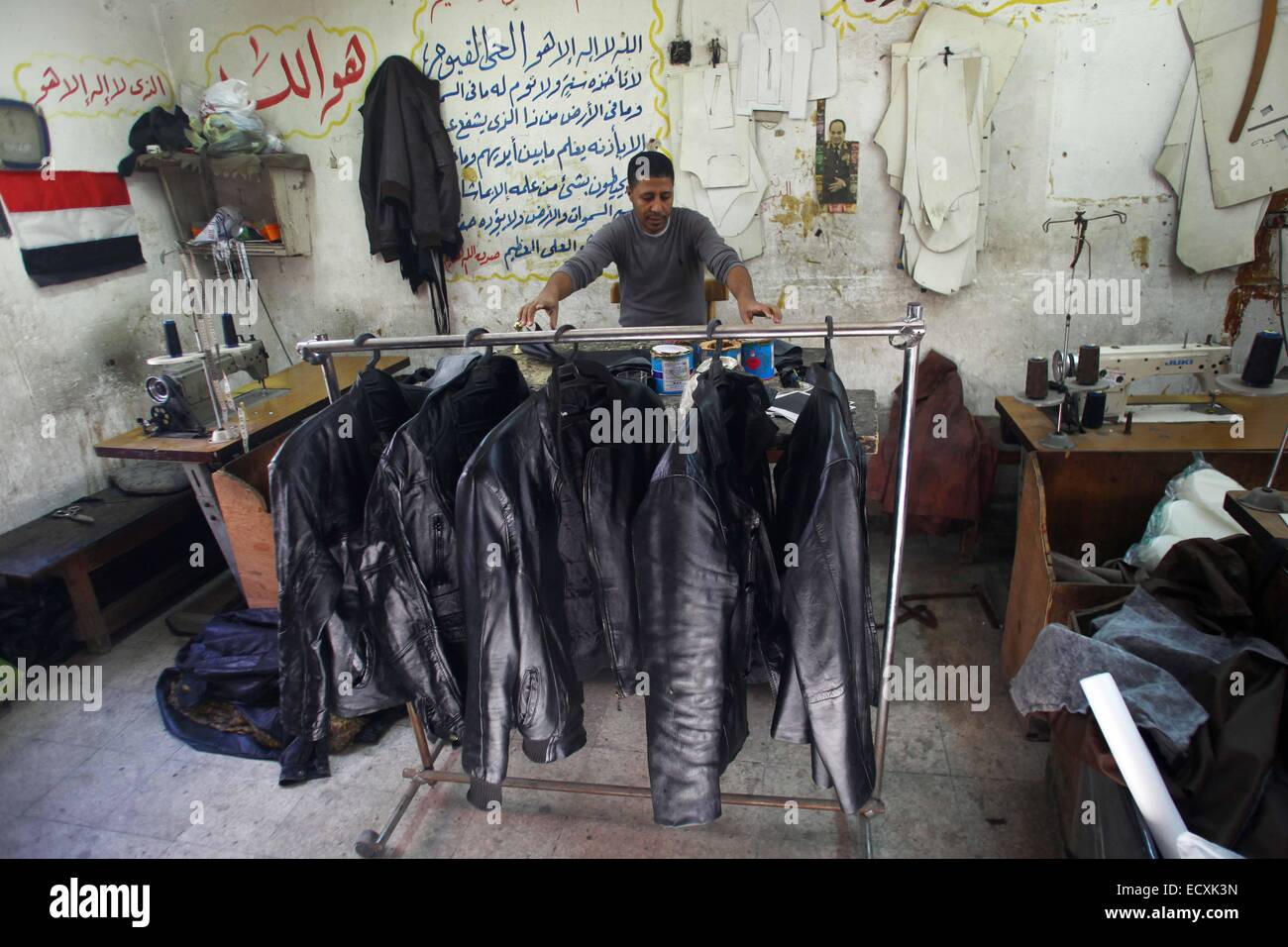 Cairo, Egypt. 20th Dec, 2014. Nasser Mohamed, 37yearold tailor, makes leather jackets in a