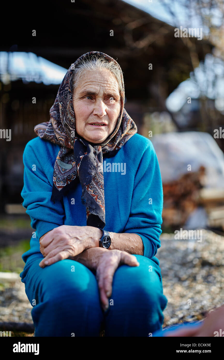 Old woman in head scarf hi-res stock photography and images - Alamy