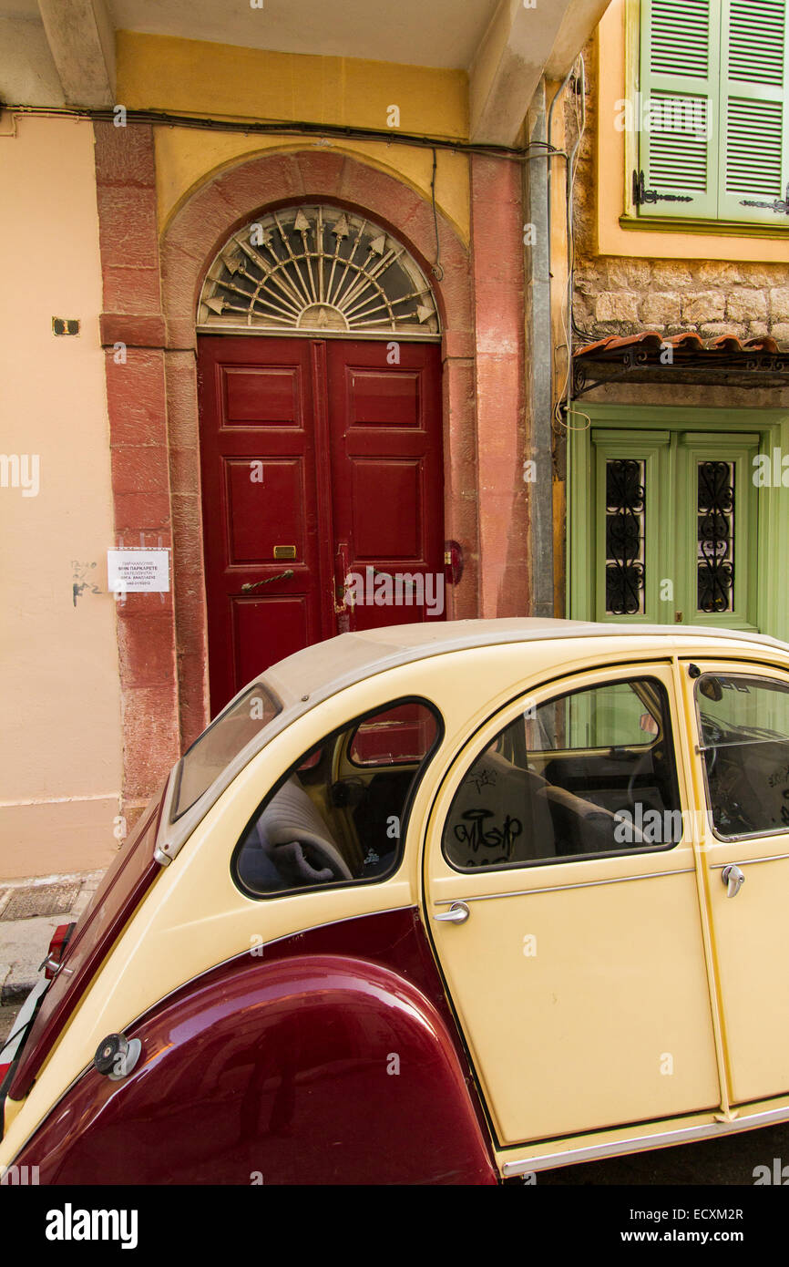 A Citroen 2CV, deux chevaux, parked in front of the entrance of a traditional house in Nafplion city Stock Photo