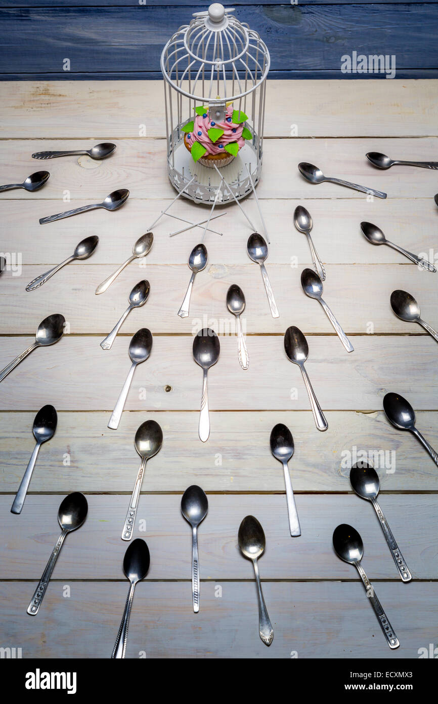Most wanted muffin and a herd teaspoons Stock Photo