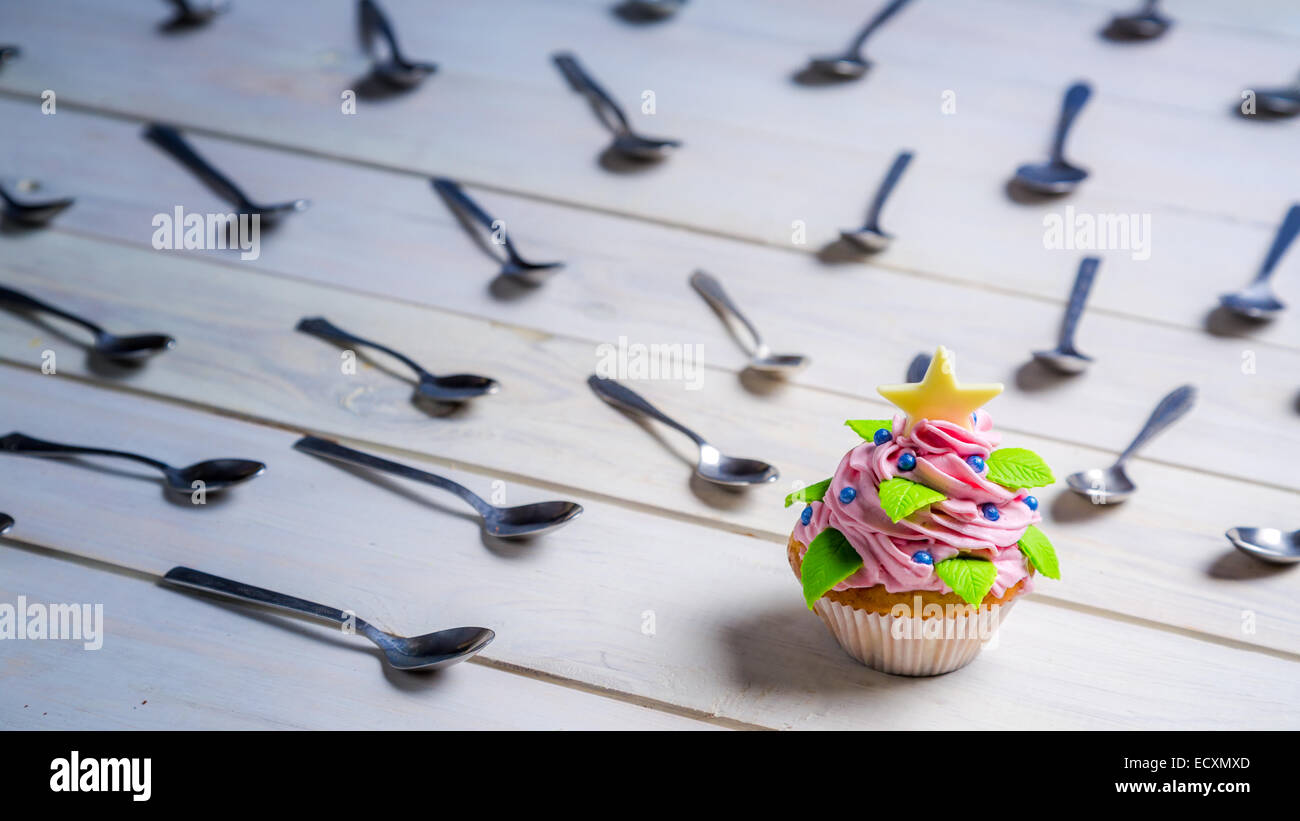 Muffin surrounded by teaspoon Stock Photo
