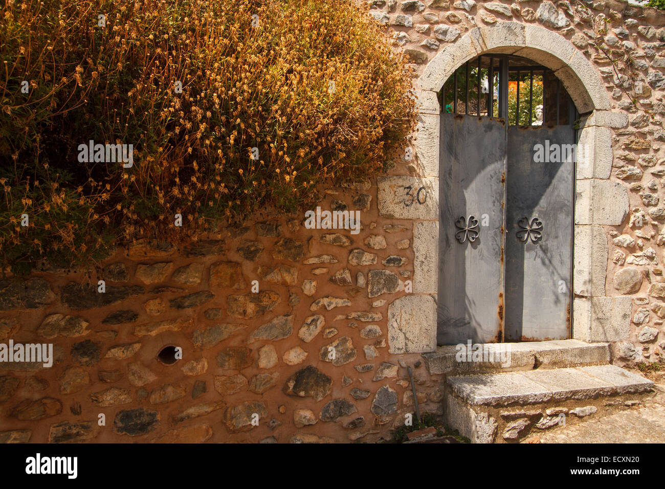 The main entrance to a traditional  house yard at Laggada village. Messenia, Peloponnese, Greece Stock Photo
