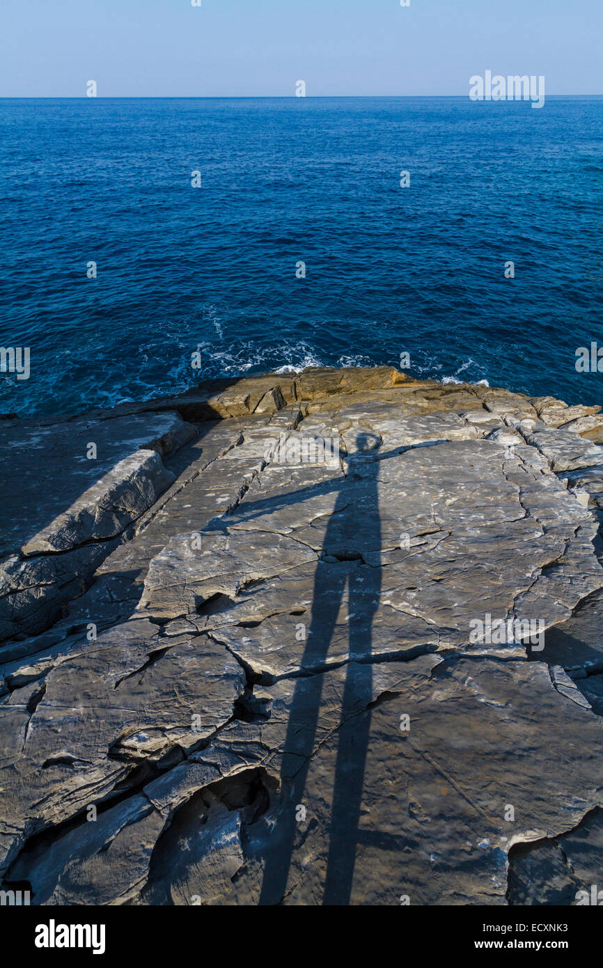 A shadow on the rock plates near Katafygio cave at Aghios Dimitrios. Messenia, Peloponnese, Greece Stock Photo