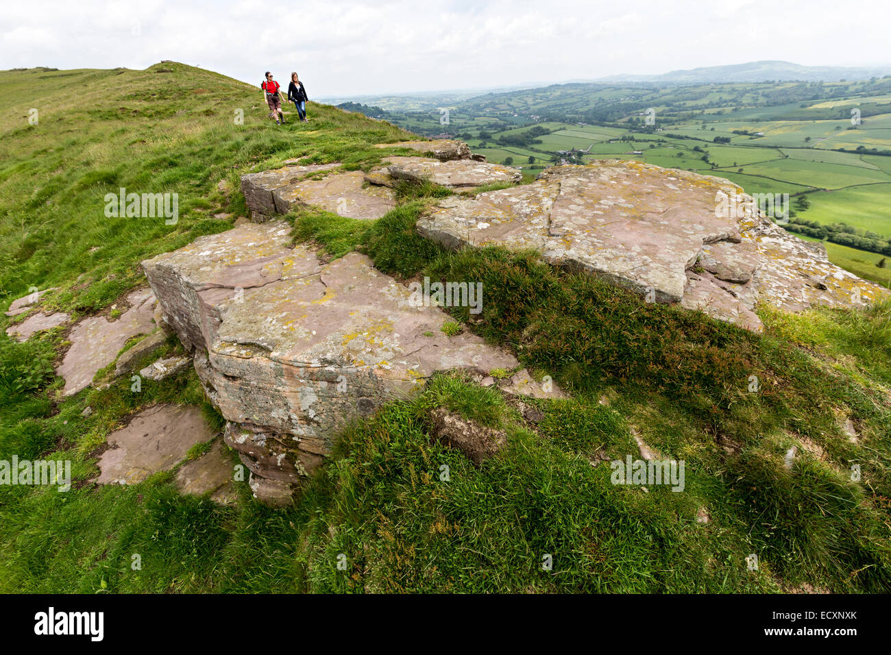 Two walkers on Bryn Arw hill near Abergavenny, Wales, UK Stock Photo