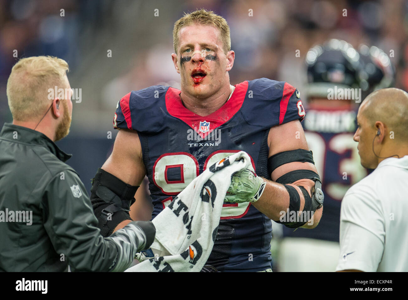 Houston, Texas, USA. 21st Dec, 2014. Houston Texans defensive end J.J. Watt  (99) looks toward the sideline with a bloody face during the 2nd half of an  NFL game between the Houston