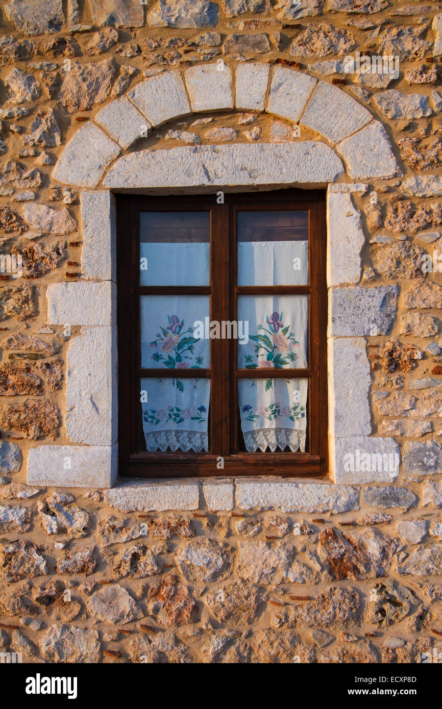 The window of a traditional house at Aghios Nikolaos fishing village. Messenia, Peloponnese, Greece Stock Photo