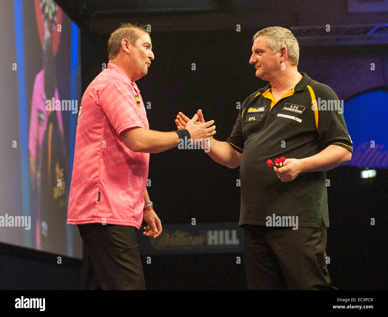 London, UK. 21st Dec, 2014. William Hill World Darts Championship. Dean Winstanley (26) [ENG] and Wayne Jones [ENG] shake hands after their match. Winstanley own the match 3-2 Credit:  Action Plus Sports/Alamy Live News Stock Photo