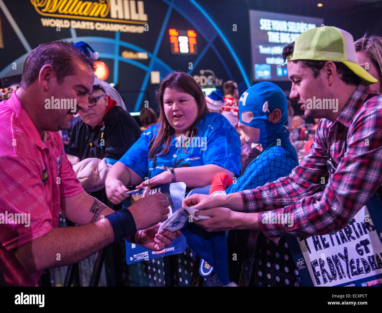 London, UK. 21st Dec, 2014. William Hill World Darts Championship. Dean Winstanley (26) [ENG] signs autographs for fans after his win over Wayne Jones [ENG]. Credit:  Action Plus Sports/Alamy Live News Stock Photo