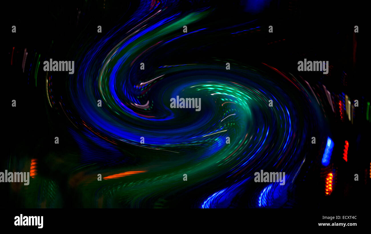 Colorful light swirl abstract in blue and green with red accents. Stock Photo
