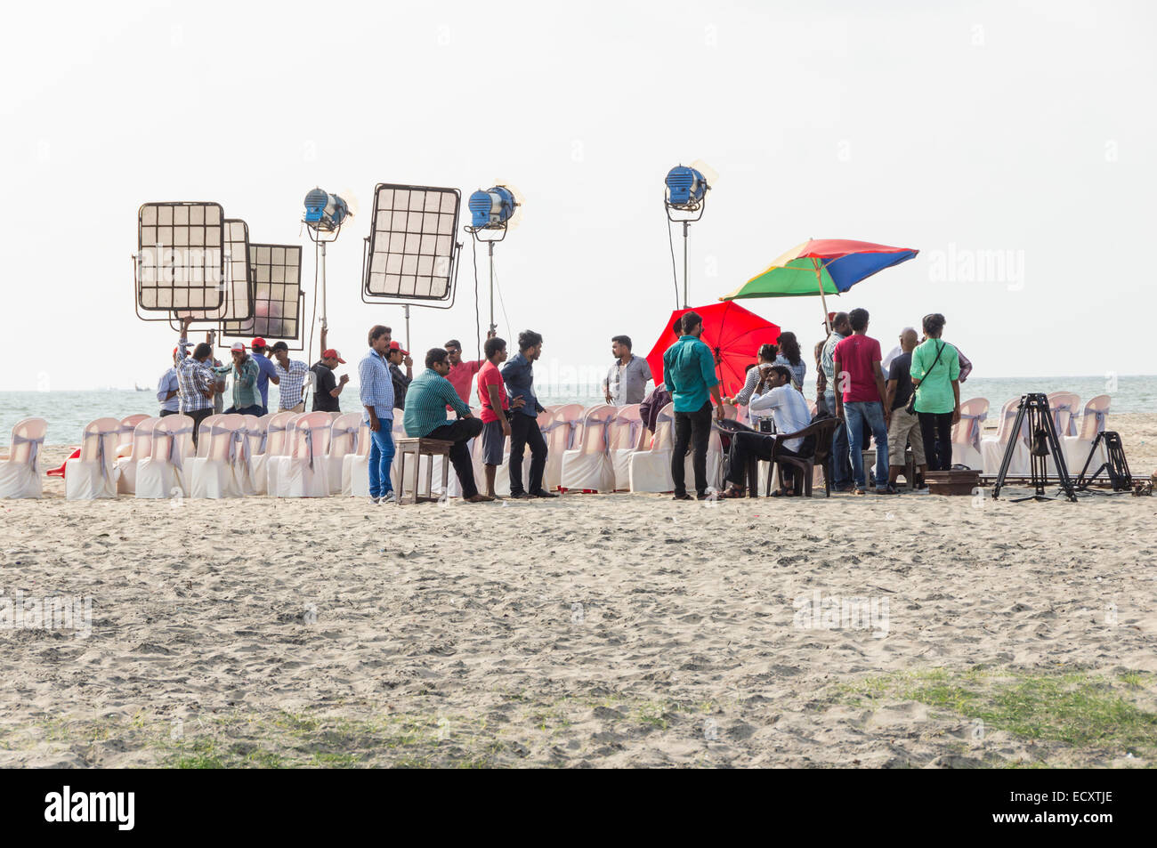 Kerala, India - Cochin. Puthuvype beach, film crew prepares to film drama with wedding scene. Stock Photo