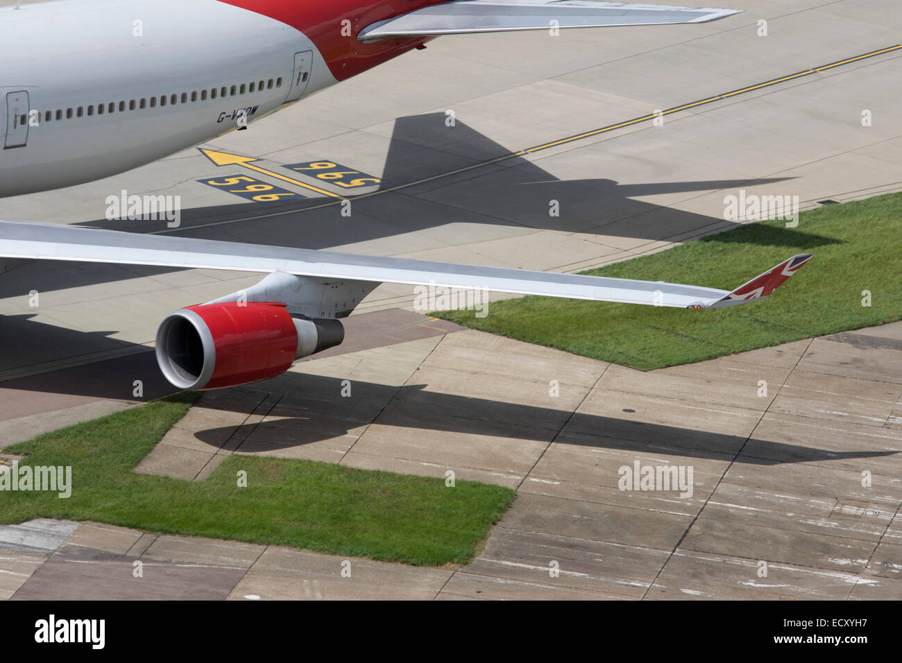 Aerial view (from control tower) of Virgin Atlantic airliner's wing and engine at London Heathrow airport. Stock Photo
