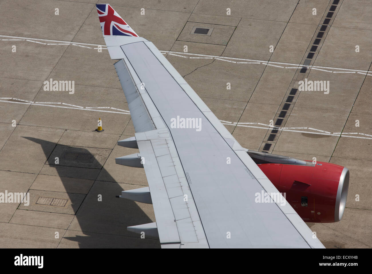Aerial view (from control tower) of Virgin Atlantic airliner's wing and engine at London Heathrow airport. Stock Photo