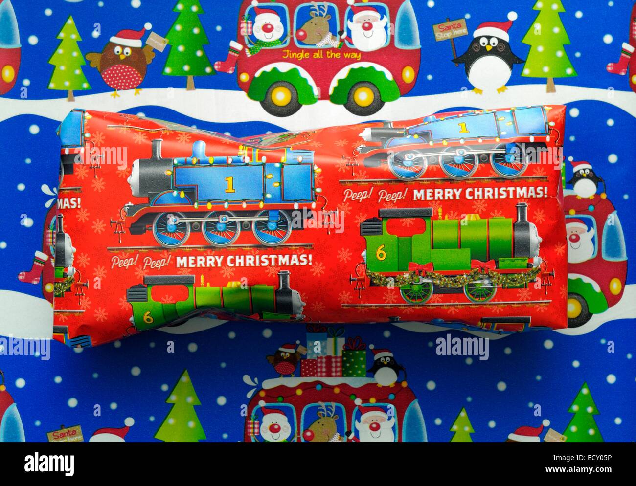 Christmas present with thomas the tank design wrapping paper England UK Stock Photo