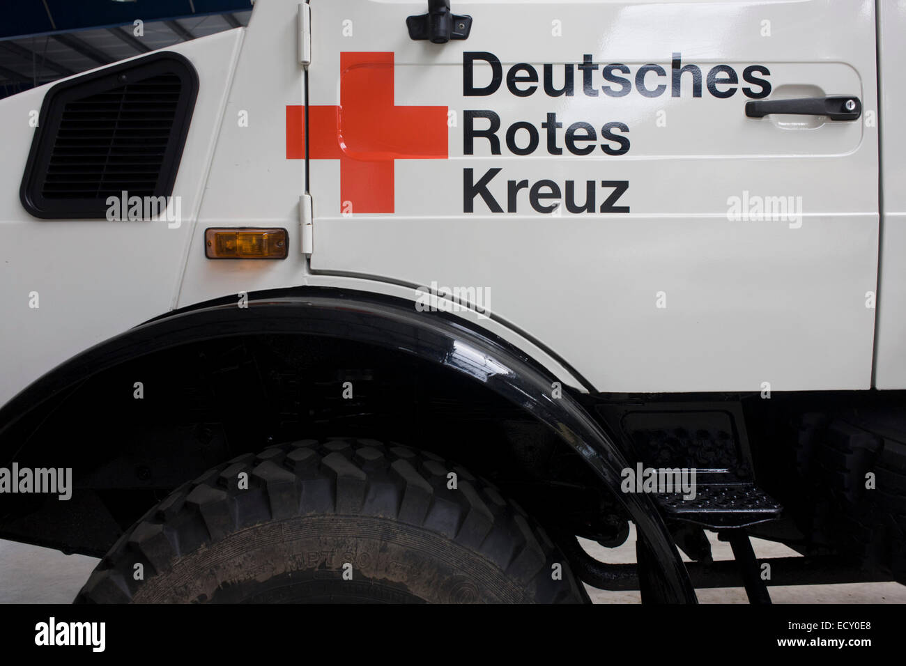 Deutsches Rotes Kreuz - DRK (German Red Cross) vehicle logos at their logistics centre at Berlin-Schönefeld airport. Stock Photo