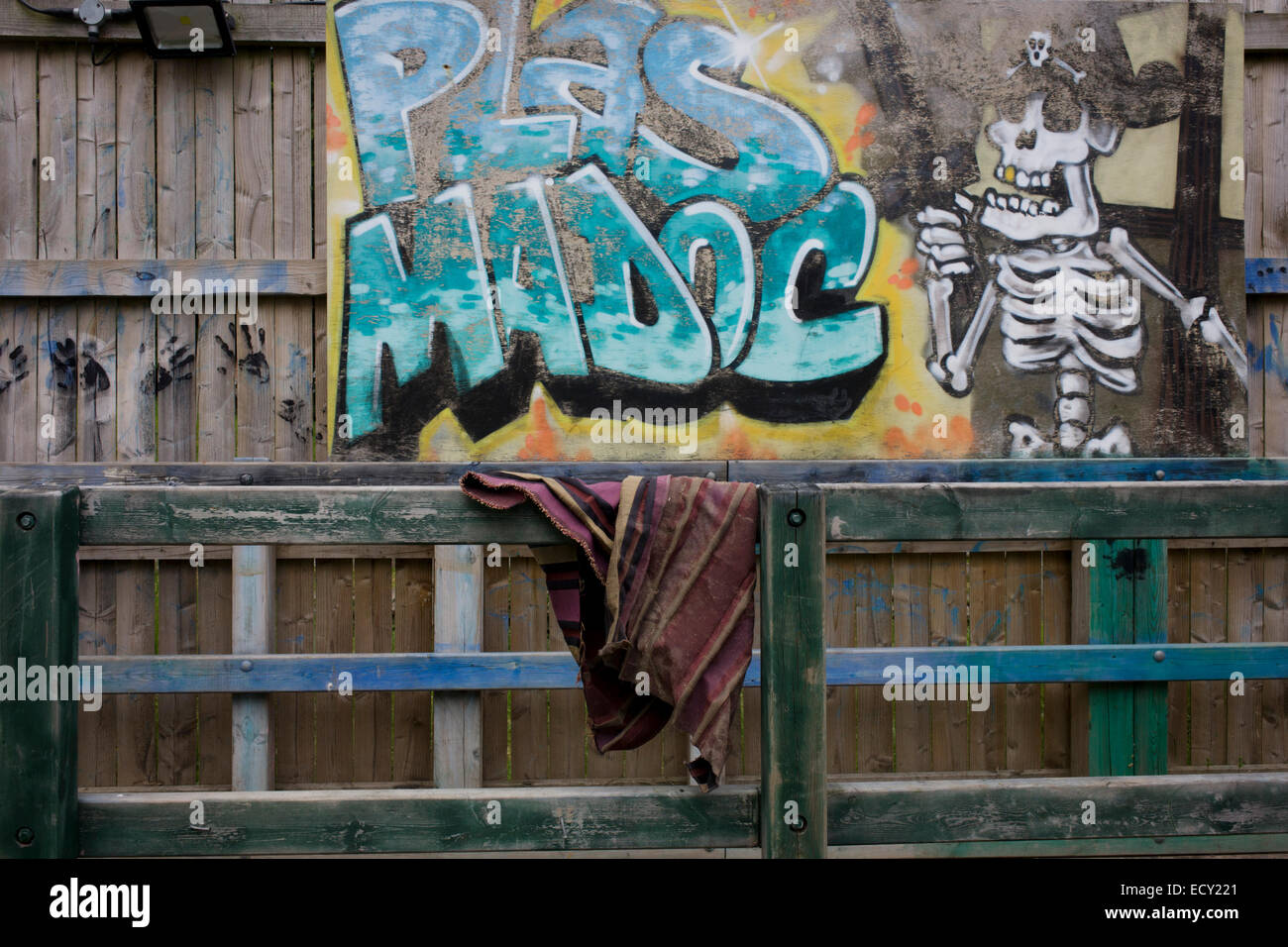 Fence graffiti in Risk averse playground called The Land on Plas Madoc Estate, Ruabon, Wrexham, Wales. Stock Photo