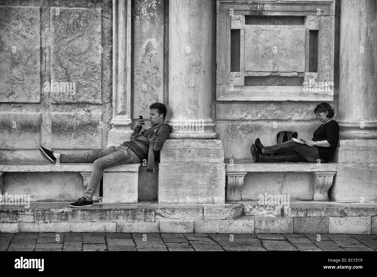 two persons relaxing in Venice Stock Photo