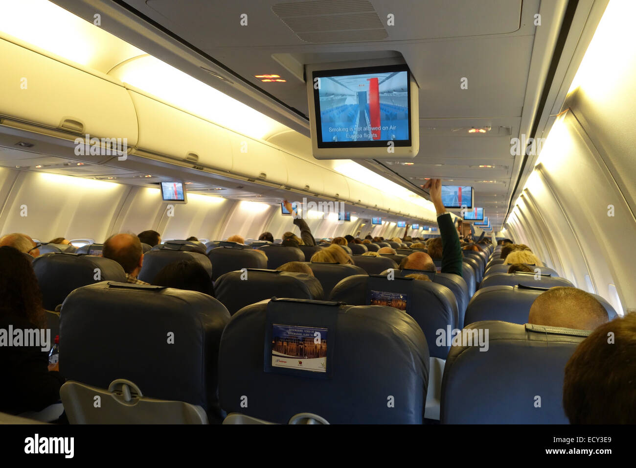 Passengers in short haul, economy class, commercial aircraft seated for takeoff, Air Europa. Stock Photo