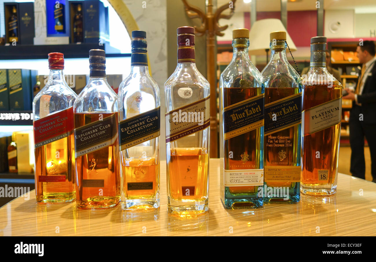 Seven different limited edition blended scotch The Johnnie Walker wisky, whiskey, bottles on display. Stock Photo