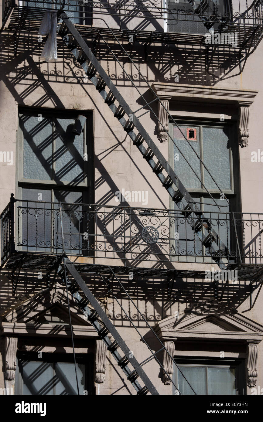 https://c8.alamy.com/comp/ECY3HN/fire-escape-ladders-and-century-old-apartment-building-built-in-stone-ECY3HN.jpg