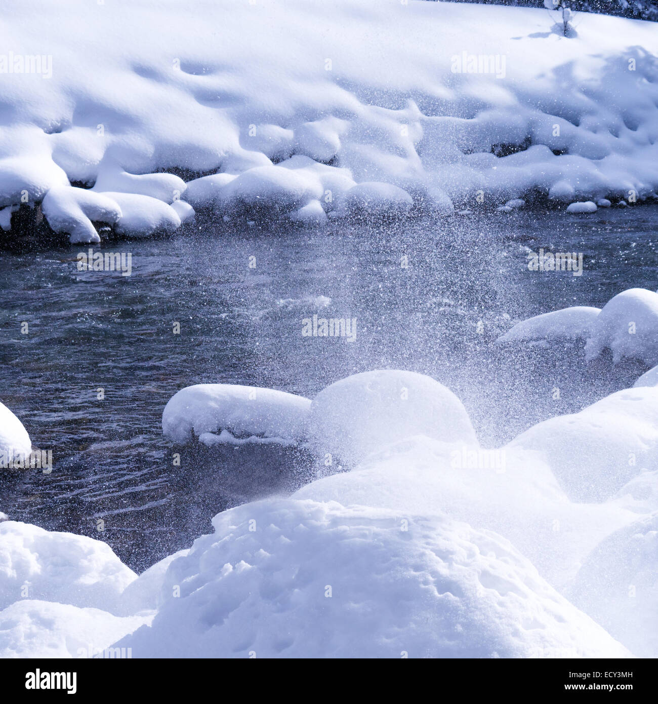 snow and water of a river in winter Stock Photo