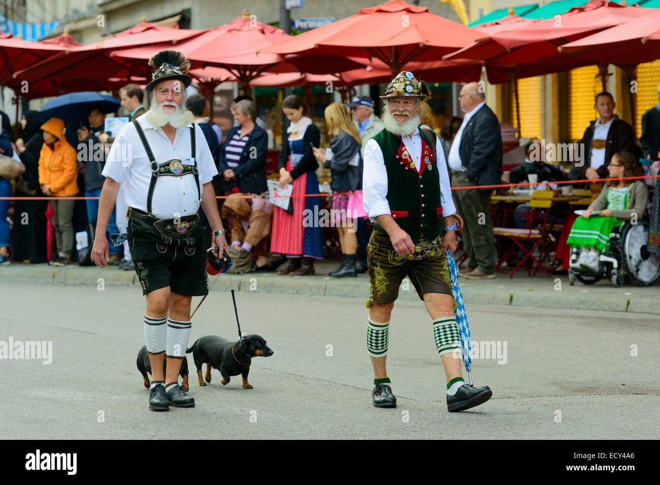 Two Munich men in traditional costume with a Dachshund, Oktoberfest Costume and Riflemen's Parade, Munich, Upper Bavaria Stock Photo
