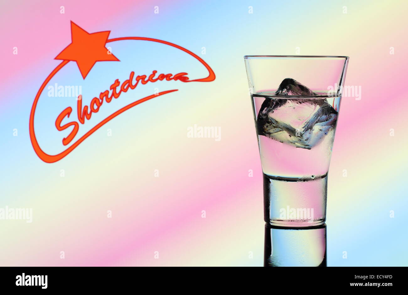 Short drink glass with clear liquid and text, colorful background Stock Photo