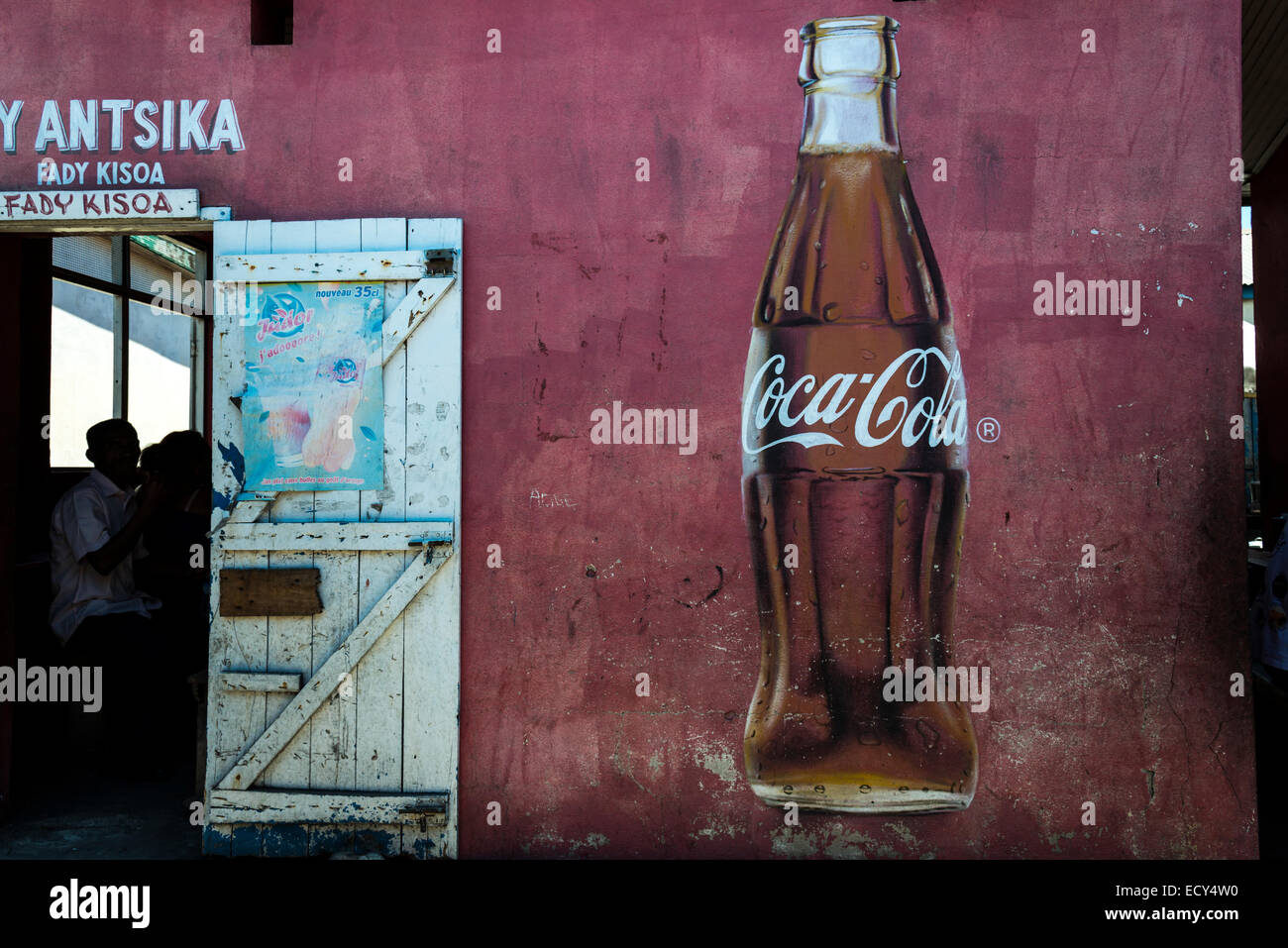 Coca Cola advertising and the open door of a restaurant, Morondava, Madagascar Stock Photo