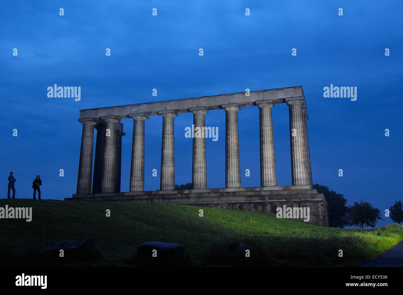 National Monument at dusk, replica of the Parthenon, designed in 1822 as a memorial to the Scots who died in the Napoleonic Wars Stock Photo