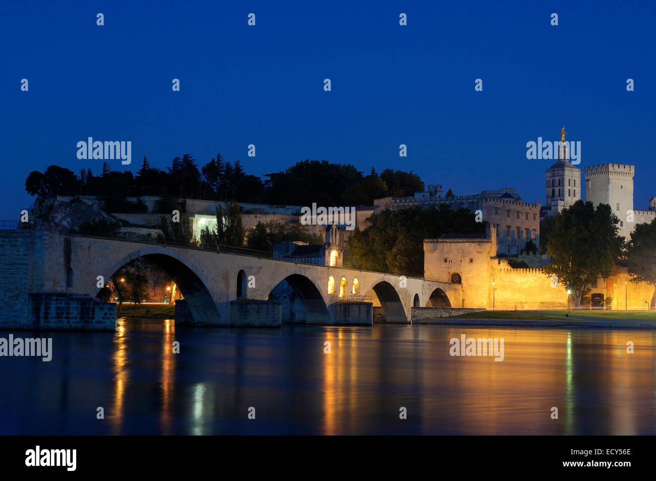 Saint Benezet bridge, Papal Palace, Palais des Papes, and Notre Dame des Doms Cathedral at dusk, Avignon, Vaucluse Stock Photo