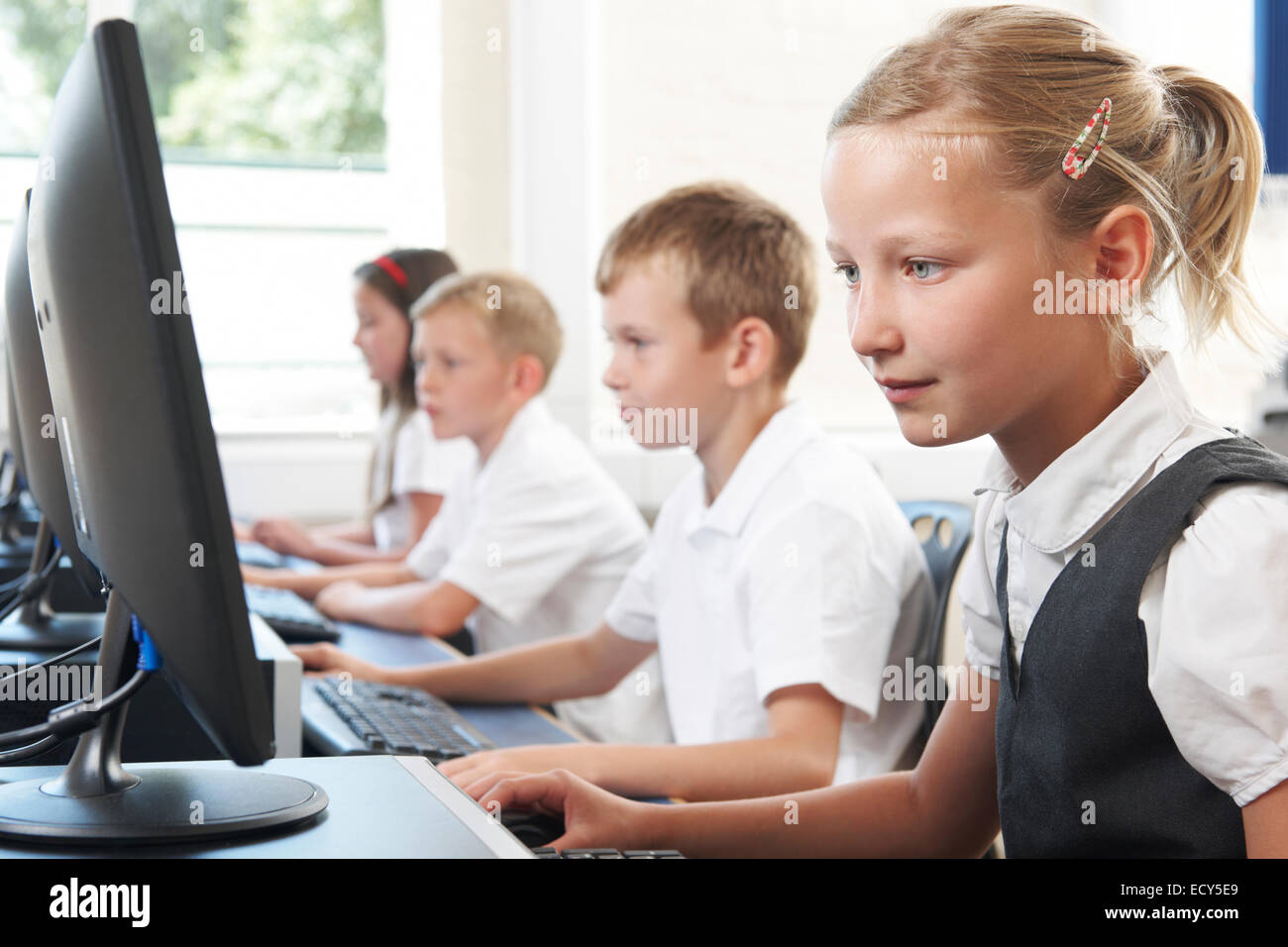 Female Elementary Pupil In Computer Class Stock Photo - Alamy