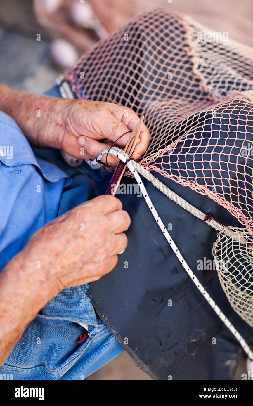 https://c8.alamy.com/comp/ECY67P/closeup-of-old-fisherman-repairing-fishing-net-ECY67P.jpg