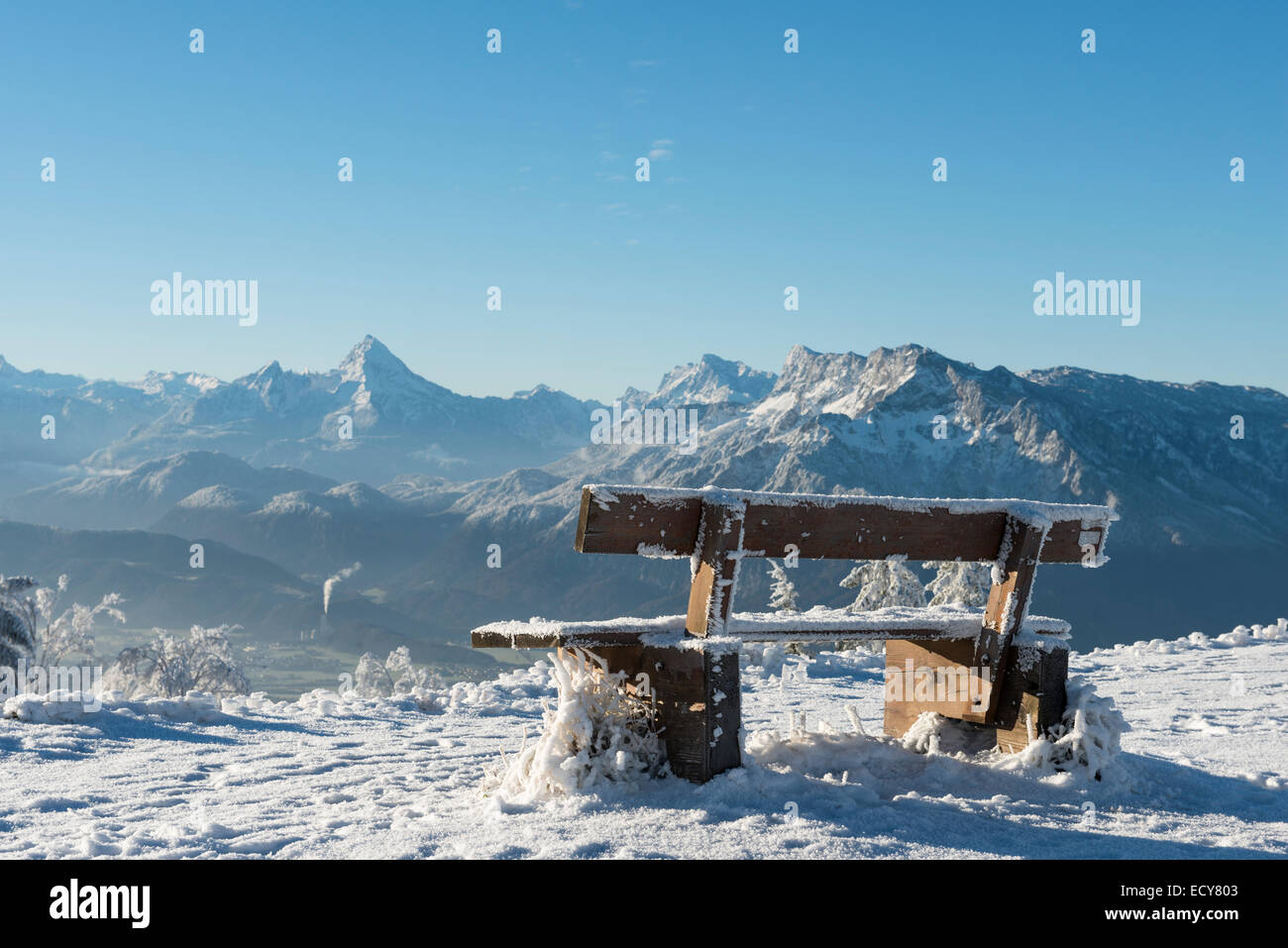 Snow-covered bench in front of Alpine panorama, rear left Watzmann, rear right Unterberg, Gaisberg, Salzburg, Austria Stock Photo