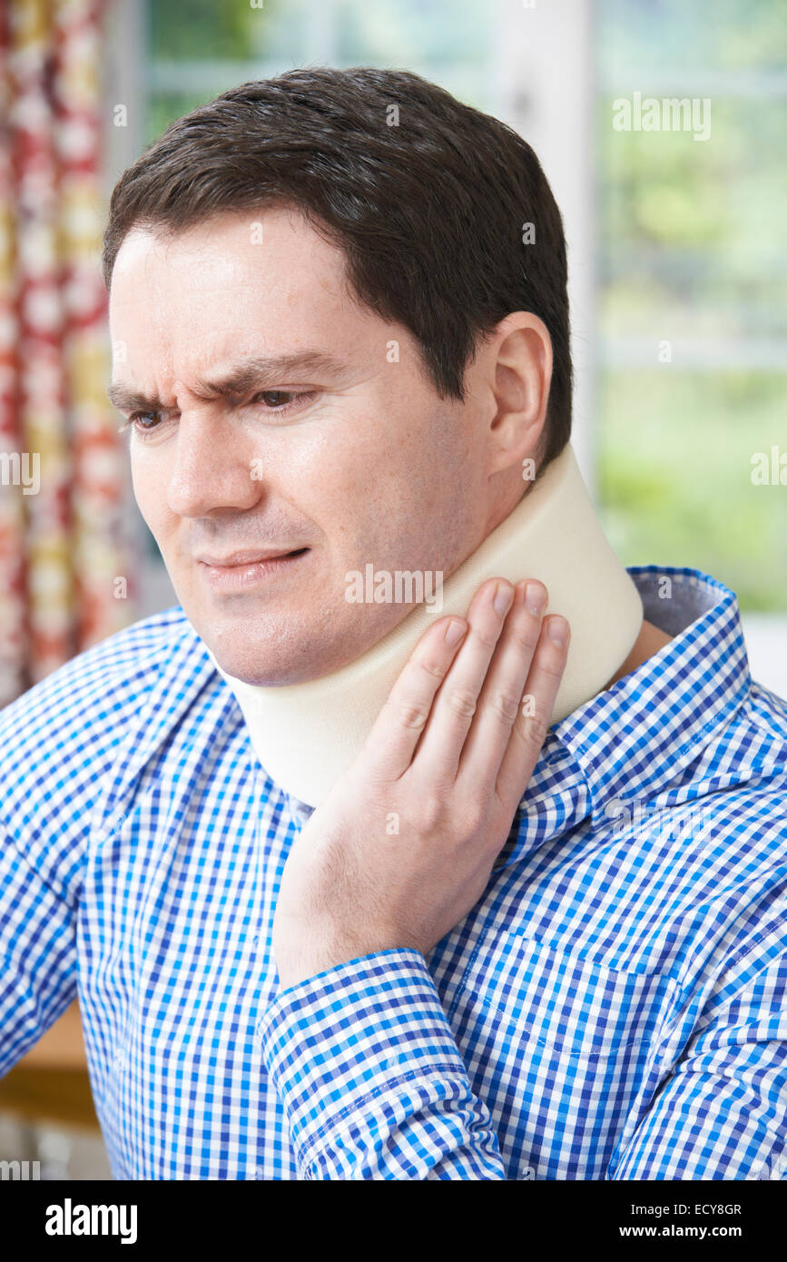 Man Wearing Surgical Collar In Pain Stock Photo Alamy