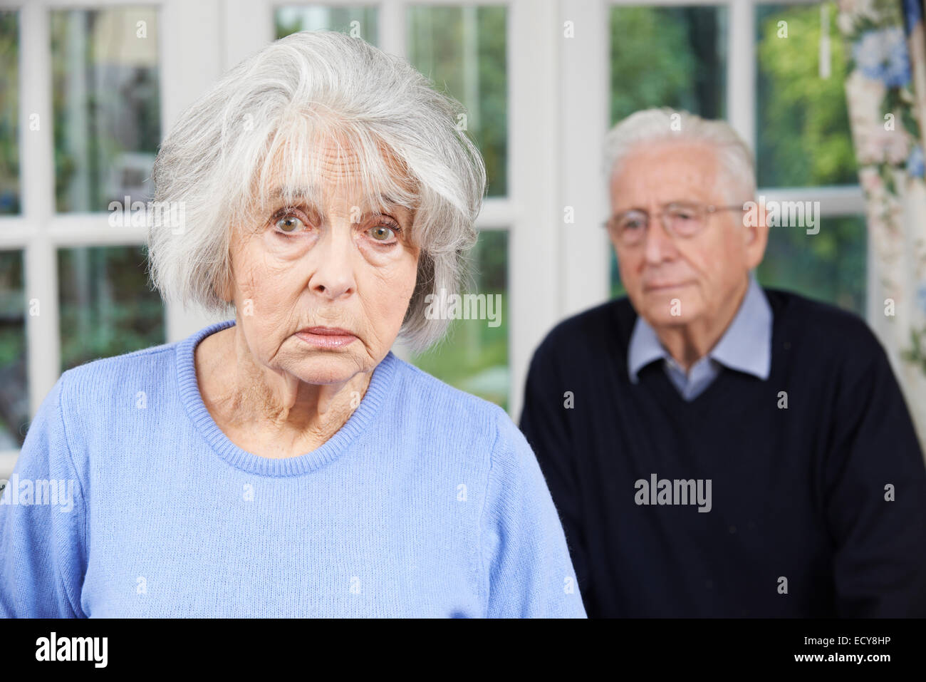 Unhappy Senior Couple At Home Together Stock Photo