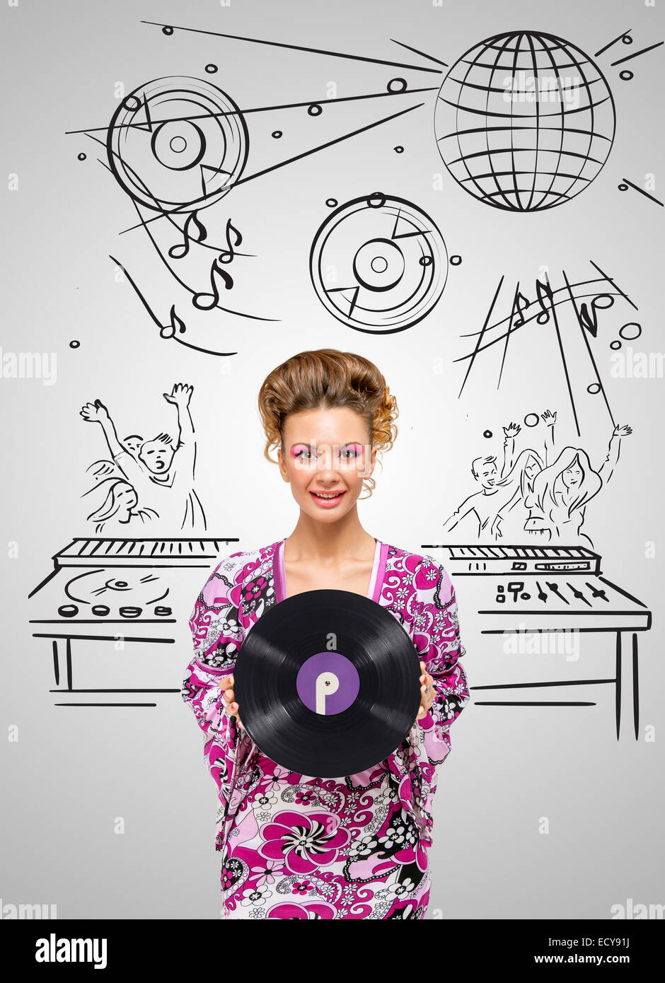 Colorful photo of a clubbing fashionable hippie deejay at the dancing party holding a retro vinyl record in her hands on grey sk Stock Photo