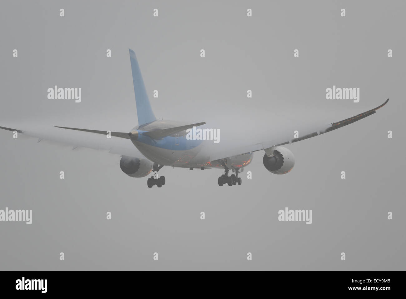 Aircraft landing in bad weather condition at London Gatwick Airport Stock Photo