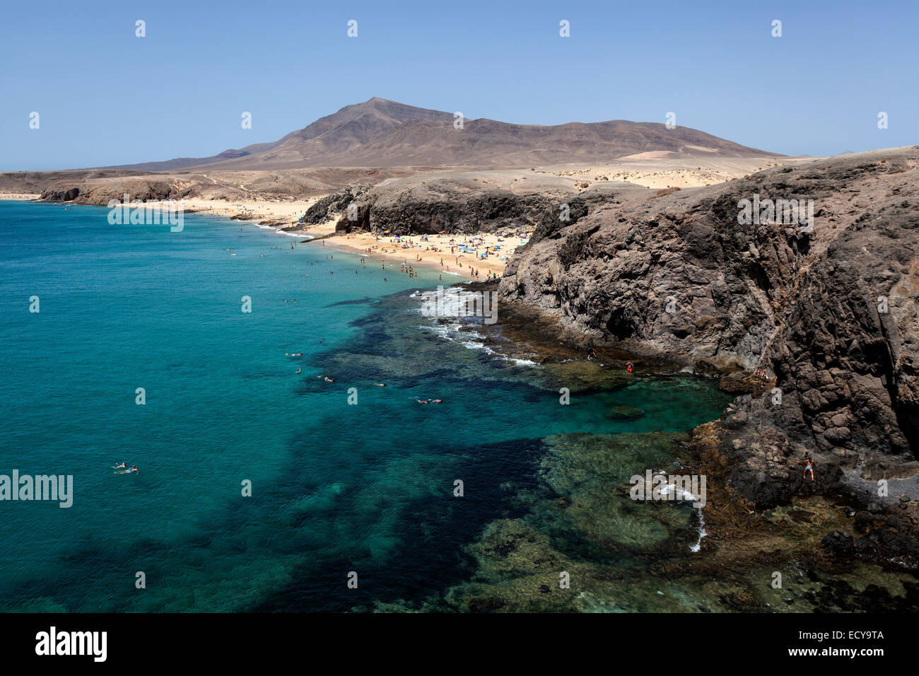 Papagayo beaches or Playas de Papagayo, Hacha Grande in the back, Lanzarote, Canary Islands, Spain Stock Photo