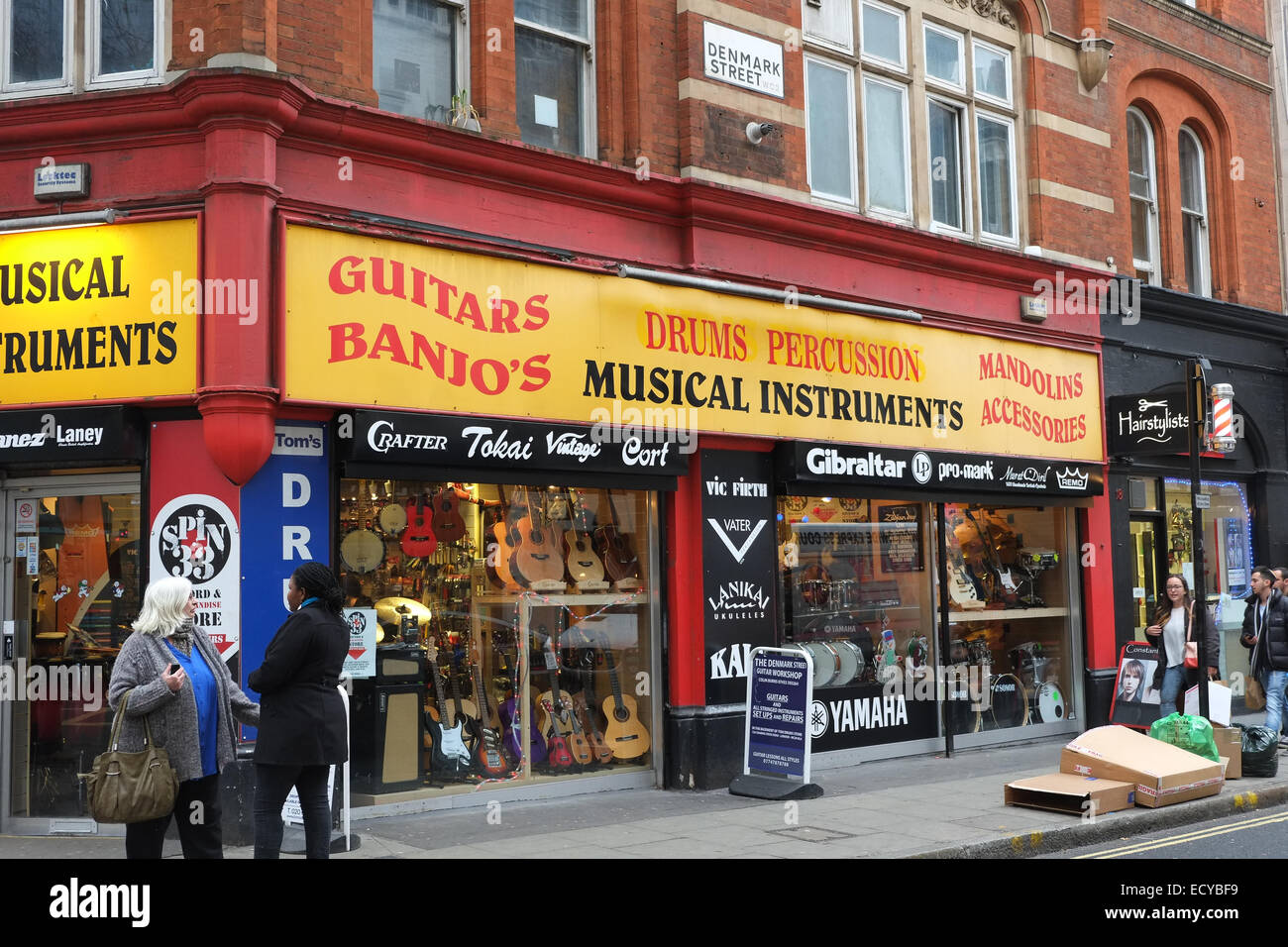 Denmark Street, London, UK. 22nd December 2014. Music shops on Denmark Street, London's 'Tin Pan Alley'. There is an on-line petition to preserve the street, the home of London's music shops, the petition already has 18,000 signatures, including Marc Almond and Pete Townshend. Credit:  Matthew Chattle/Alamy Live News Stock Photo