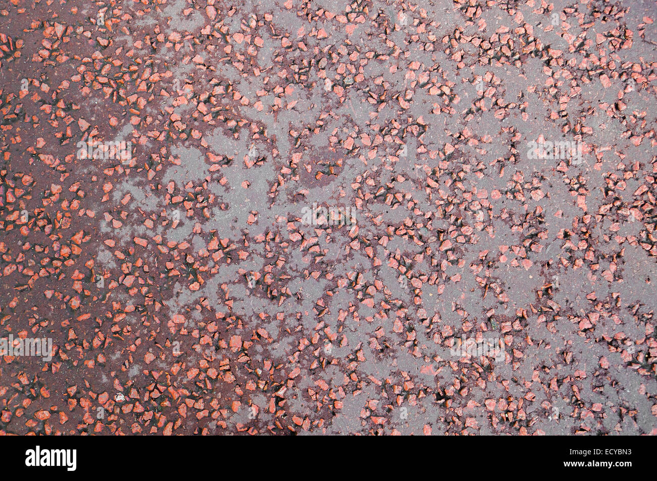 Closeup of red tarmac background. Texture of a tarmac road Stock Photo