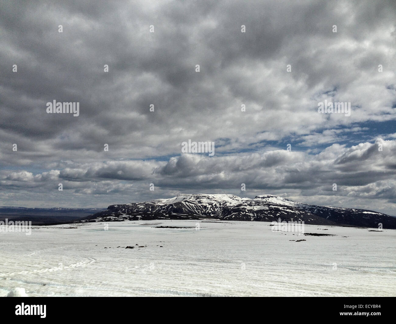 Clouds over snowy mountains in remote landscape - Smartphone Captured Stock Image