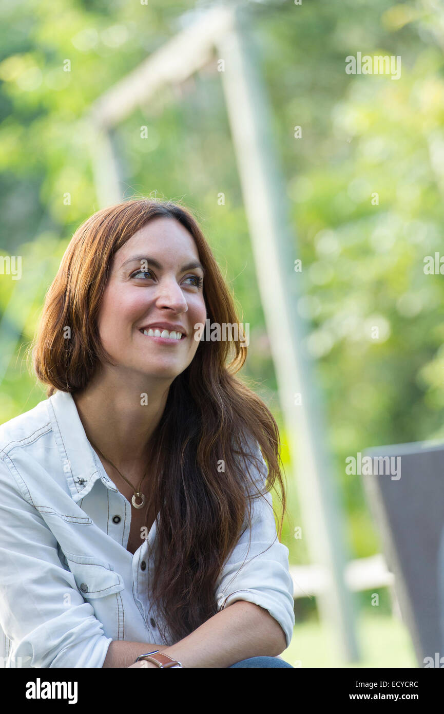 Hispanic woman smiling outdoors Stock Photo