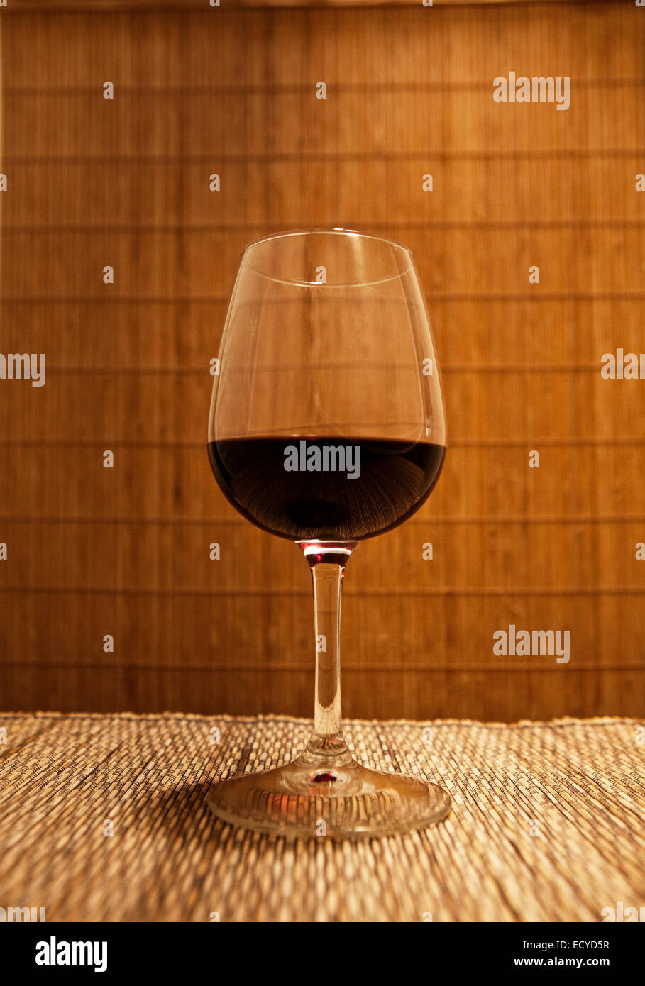 Close up of glass of red wine on table Stock Photo